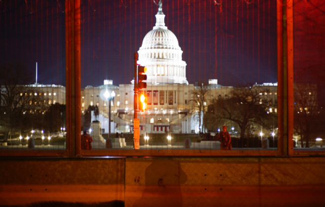 The US Capitol Building Behind a Fence with Barbed Wire after the January 6 Insurrection