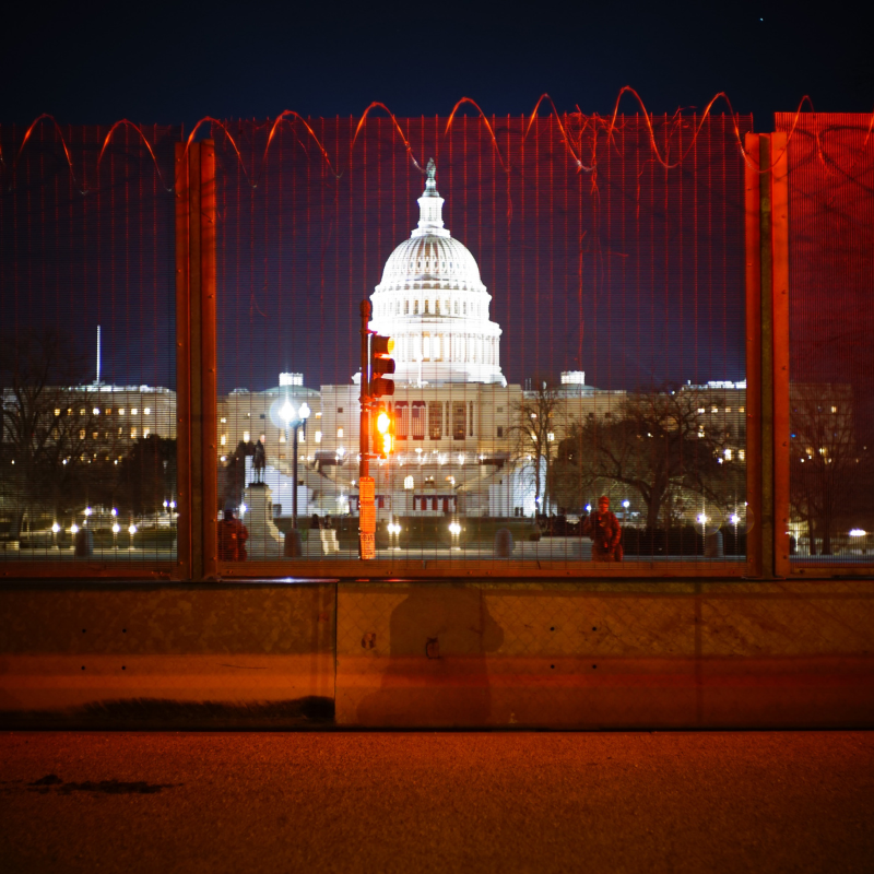The US Capitol Building Behind a Fence with Barbed Wire after the January 6 Insurrection